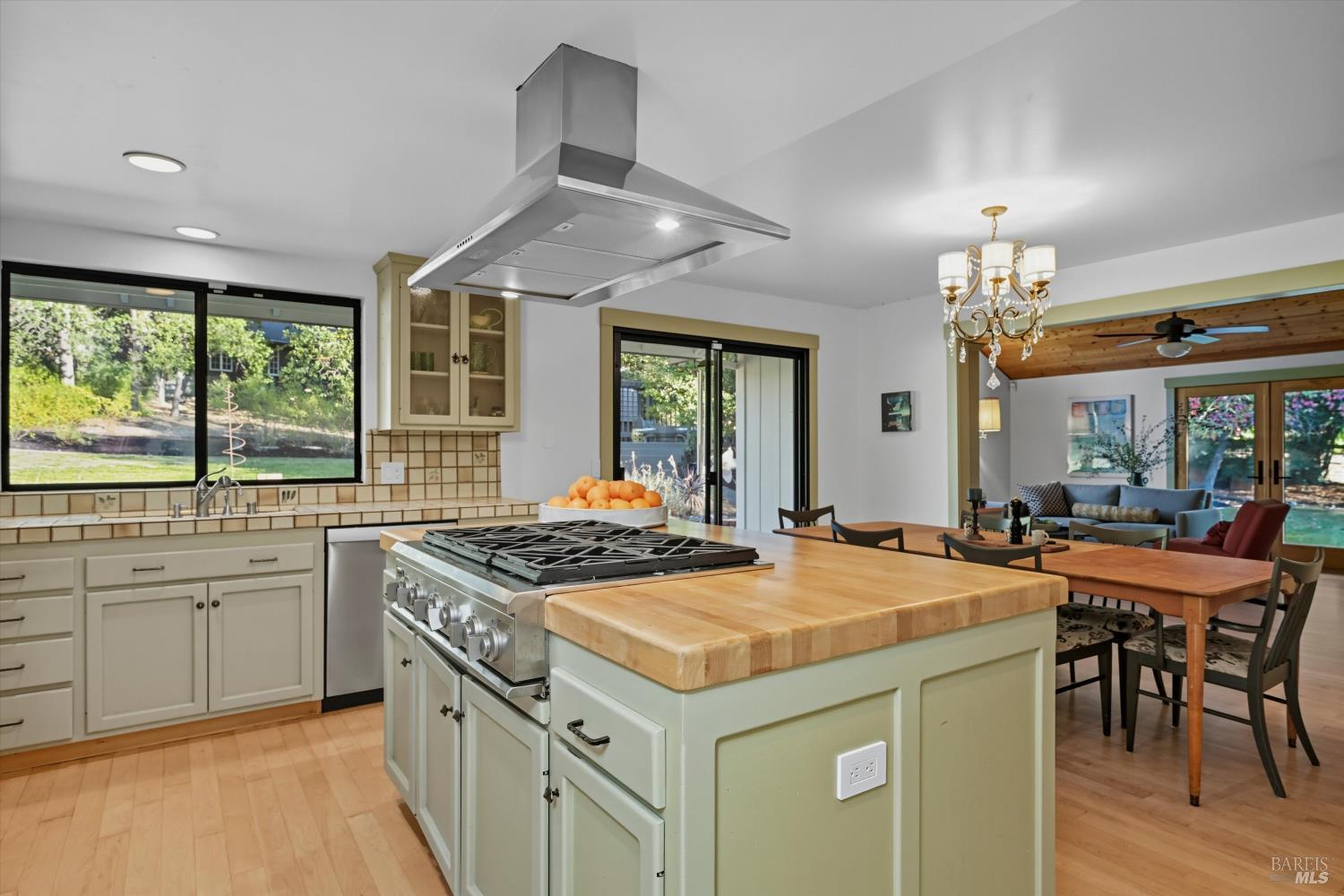 246 Zinfandel Road Healdsburg, CA 95448 - Photo 11 of 50 a kitchen that has a sink a stove and a table in it