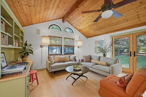 a view of a table and chairs in backyard of the house