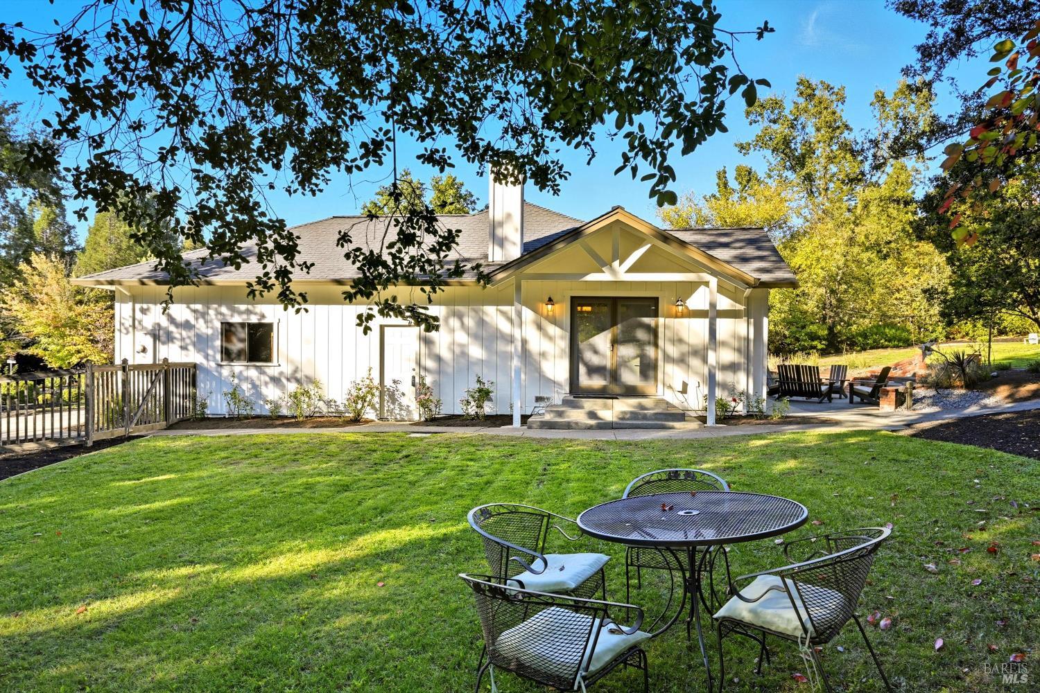 246 Zinfandel Road Healdsburg, CA 95448 - Photo 13 of 50 a view of a table and chairs in backyard of the house