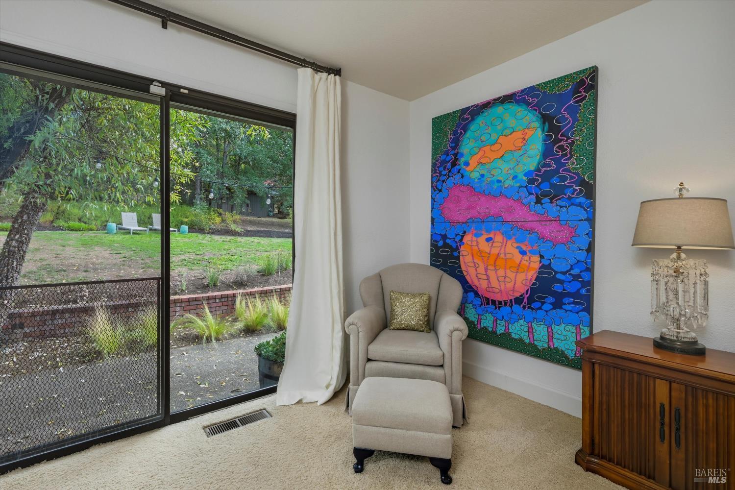 246 Zinfandel Road Healdsburg, CA 95448 - Photo 20 of 50 a living room with furniture and a floor to ceiling window
