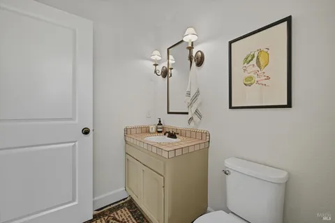 a view of a swimming pool with chairs in patio