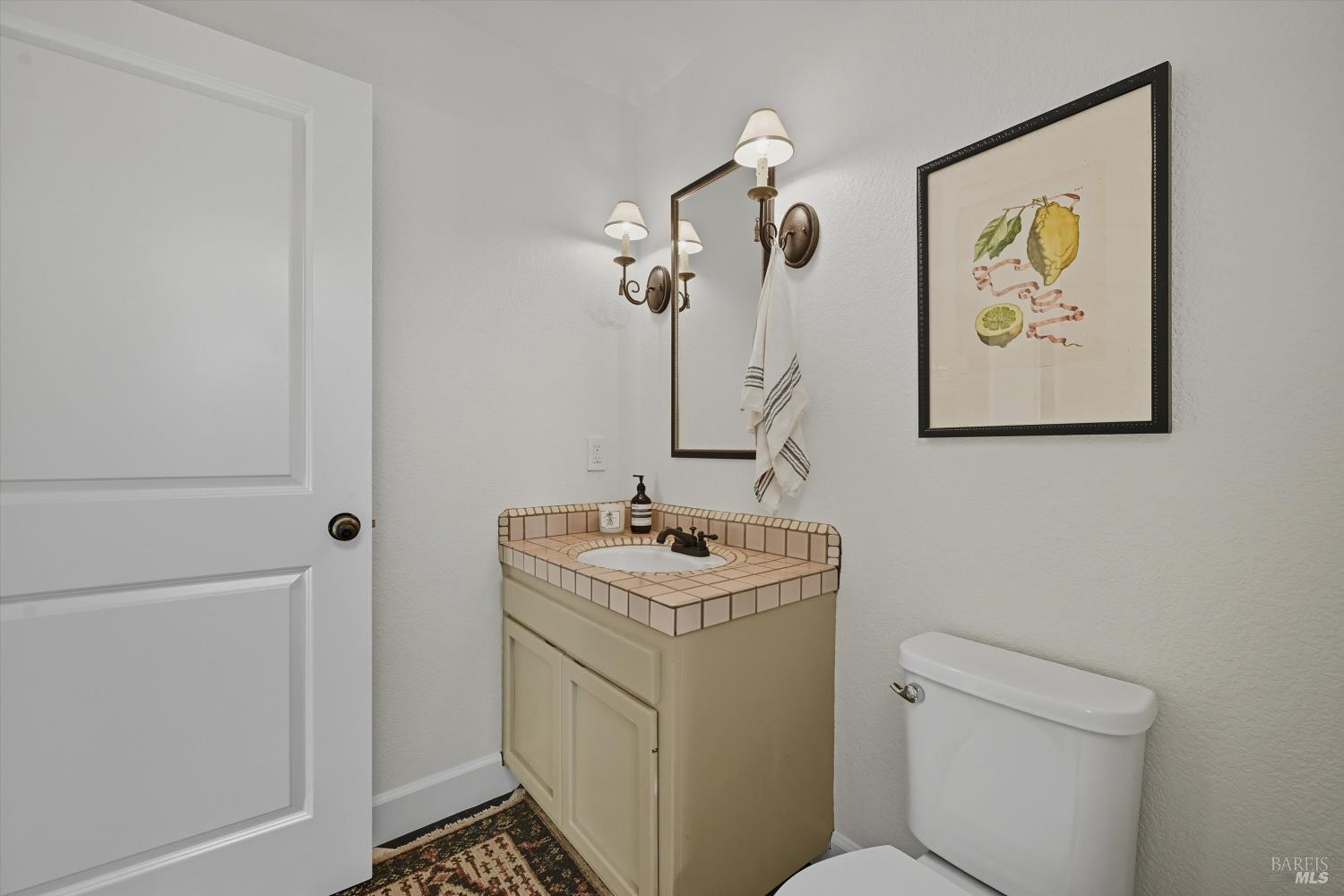 246 Zinfandel Road Healdsburg, CA 95448 - Photo 31 of 50 a bathroom with a sink toilet and vanity