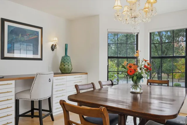 a kitchen with stainless steel appliances a sink and a refrigerator
