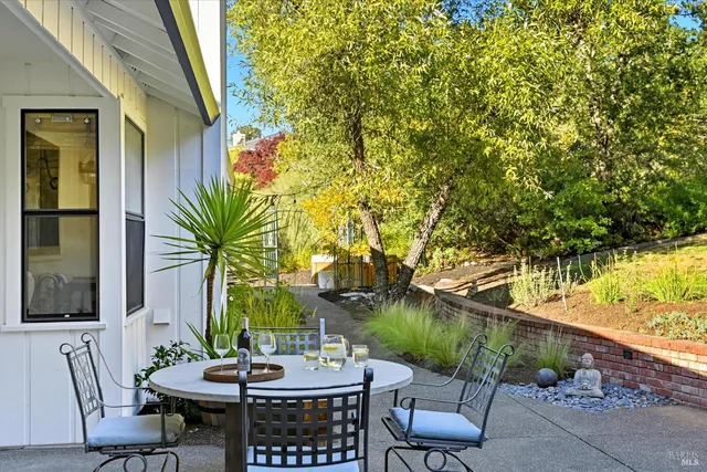 a kitchen that has a sink a stove and a table in it