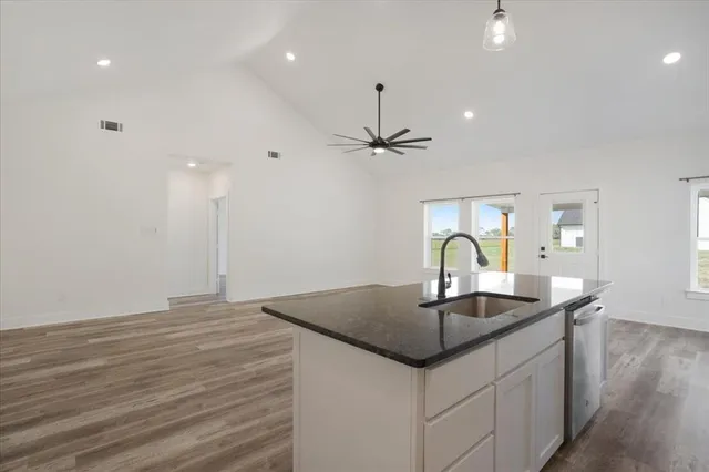 a view of a house with yard and tree s