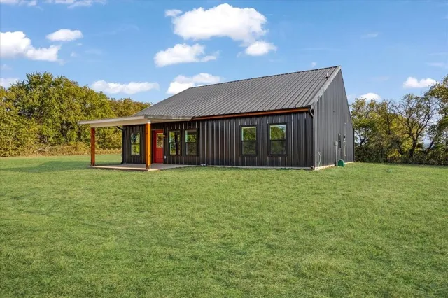 a view of a yard with an outdoor seating