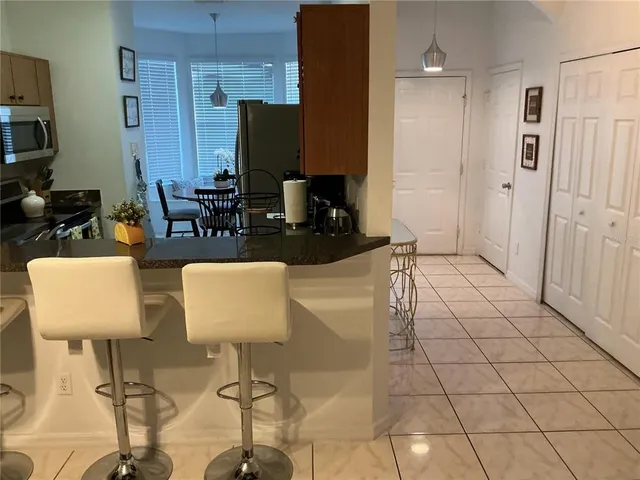 a view of kitchen and dining area with furniture