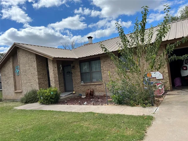 a view of a house with a garden