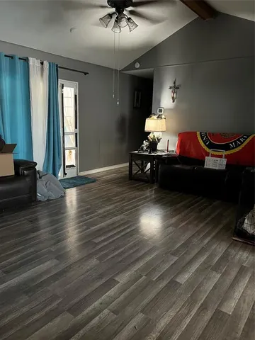a room with furniture and wooden floor