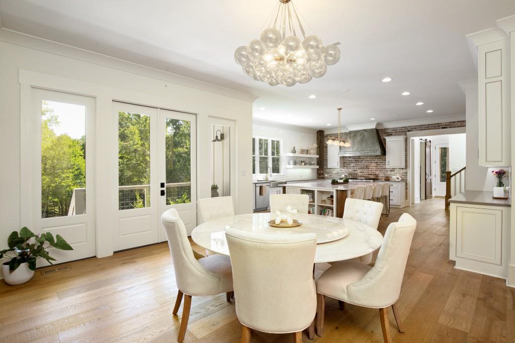 13235 Arnold Mill Road Roswell, GA 30075 - Photo 12 of 72 a view of a dining room with furniture window and wooden floor
