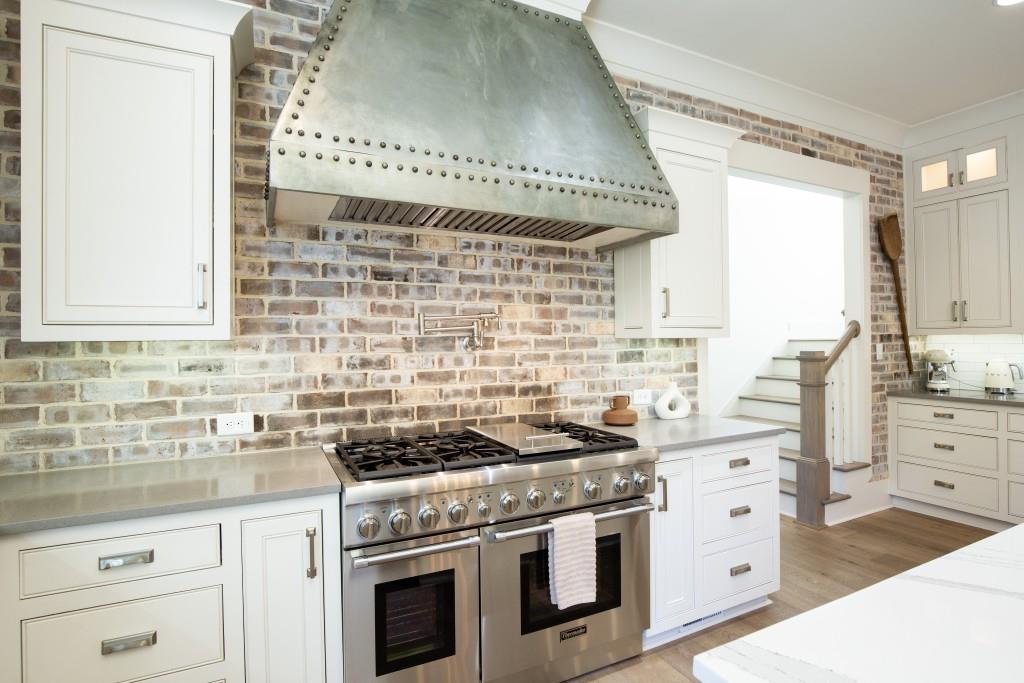 13235 Arnold Mill Road Roswell, GA 30075 - Photo 16 of 72 a kitchen with granite countertop a stove and a sink