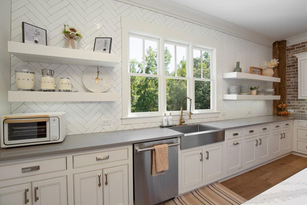 13235 Arnold Mill Road Roswell, GA 30075 - Photo 17 of 72 a kitchen with granite countertop white cabinets and window