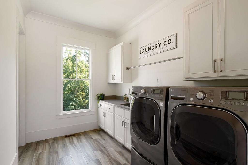13235 Arnold Mill Road Roswell, GA 30075 - Photo 20 of 72 a utility room with sink dryer and washer