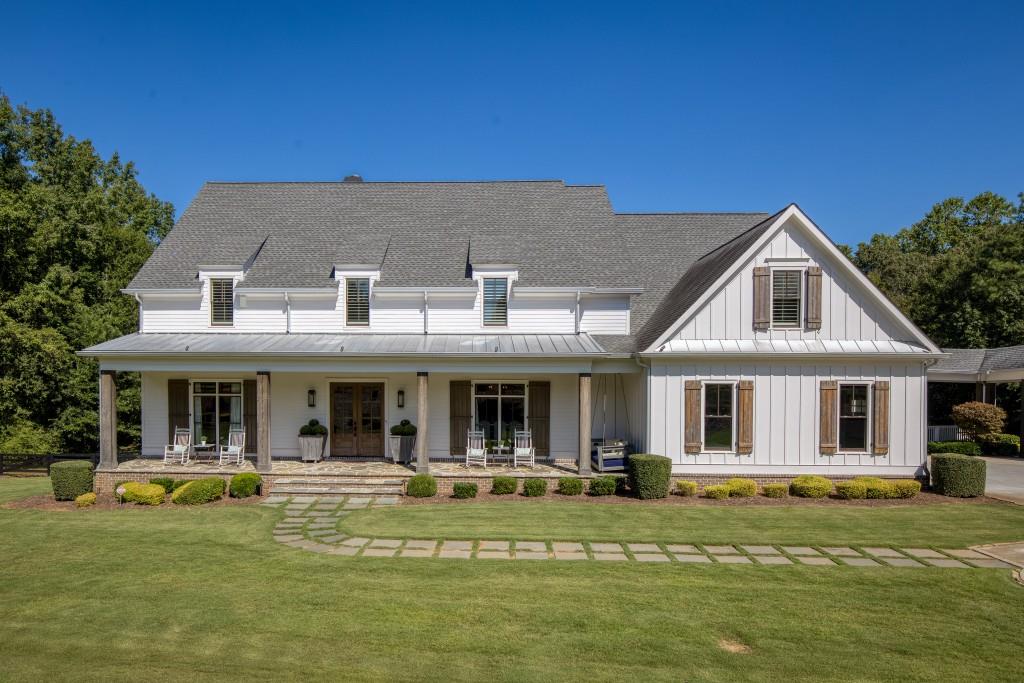 13235 Arnold Mill Road Roswell, GA 30075 - Photo 2 of 72 a front view of a house with swimming pool having outdoor seating