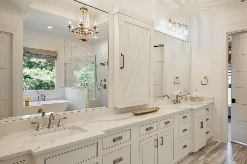 13235 Arnold Mill Road Roswell, GA 30075 - Photo 27 of 72 a bathroom with double vanity sinks a large mirror and a shower