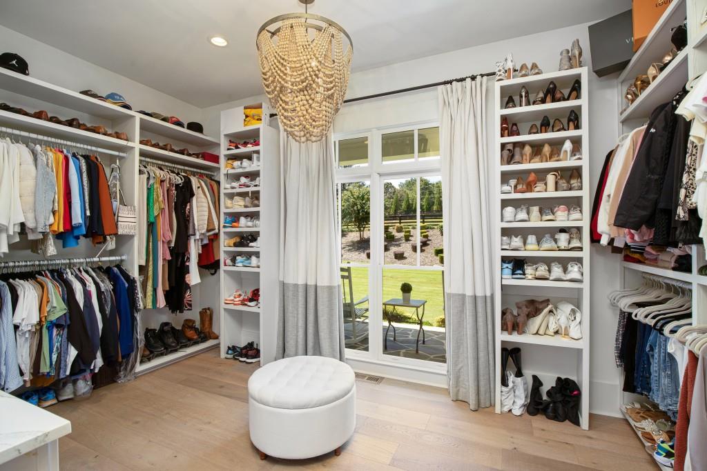13235 Arnold Mill Road Roswell, GA 30075 - Photo 29 of 72 a view of walk in closet with clothes and shoes