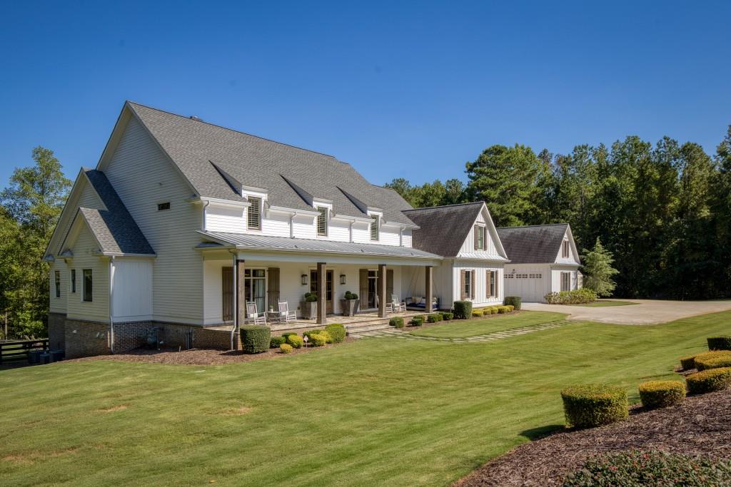 13235 Arnold Mill Road Roswell, GA 30075 - Photo 3 of 72 a front view of a house with garden and trees