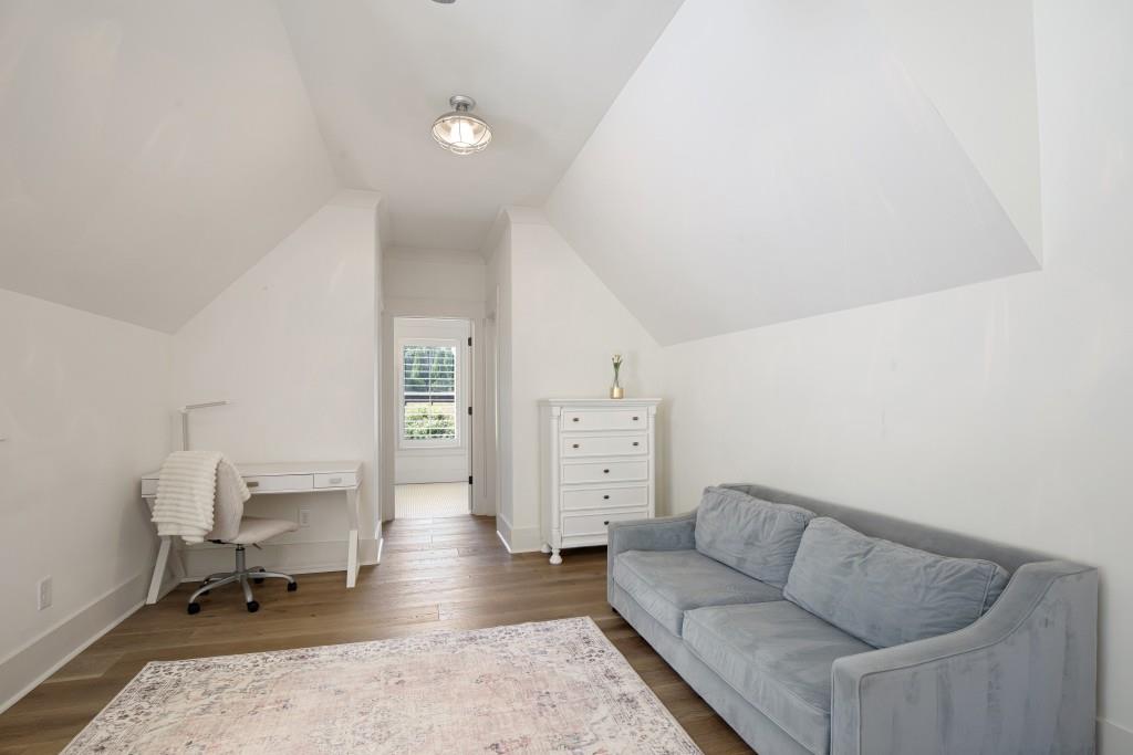 13235 Arnold Mill Road Roswell, GA 30075 - Photo 35 of 72 a living room with furniture and a rug