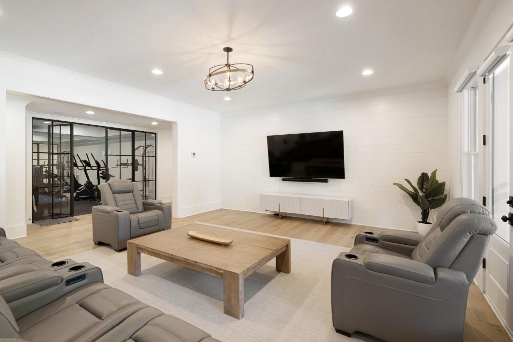 13235 Arnold Mill Road Roswell, GA 30075 - Photo 41 of 72 a living room with furniture and a flat screen tv