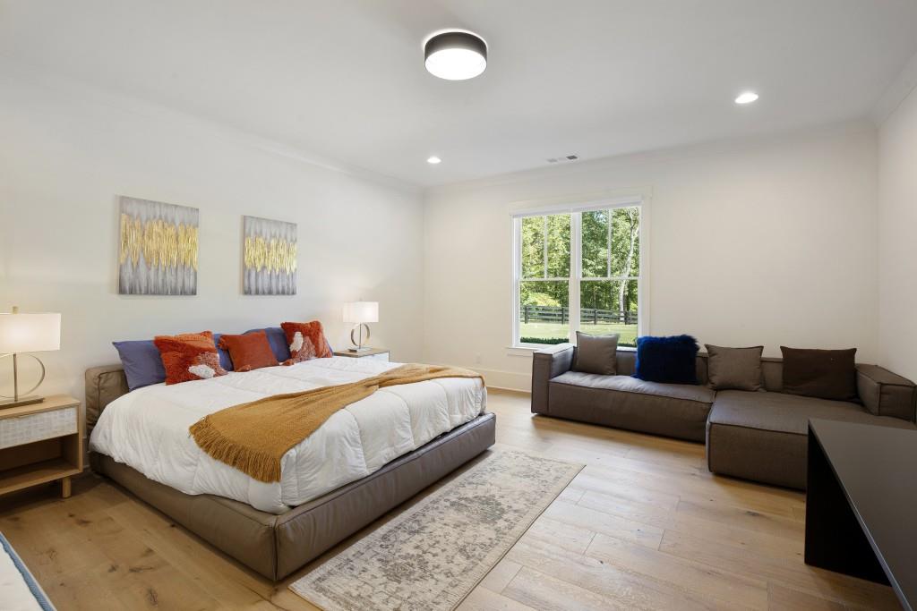 13235 Arnold Mill Road Roswell, GA 30075 - Photo 46 of 72 a bedroom with a bed couch and window