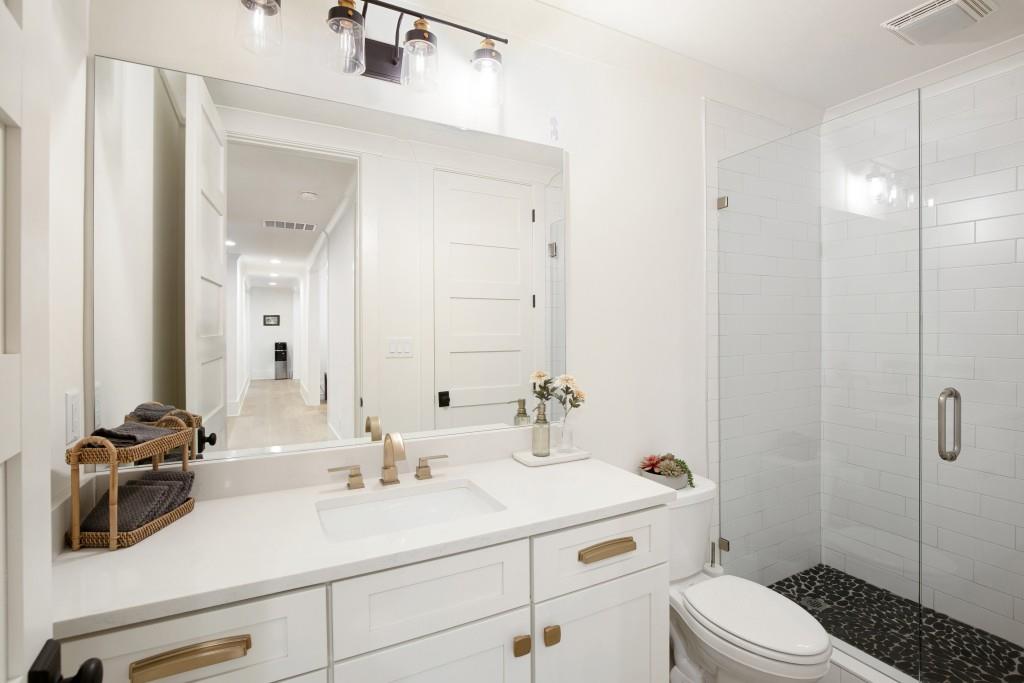 13235 Arnold Mill Road Roswell, GA 30075 - Photo 47 of 72 a bathroom with a sink a toilet and shower