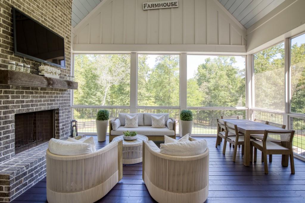 13235 Arnold Mill Road Roswell, GA 30075 - Photo 48 of 72 a living room with furniture a flat screen tv and a fireplace