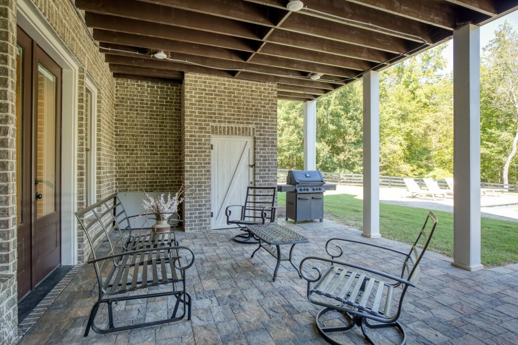 13235 Arnold Mill Road Roswell, GA 30075 - Photo 52 of 72 a view of a patio with table and chairs and wooden floor