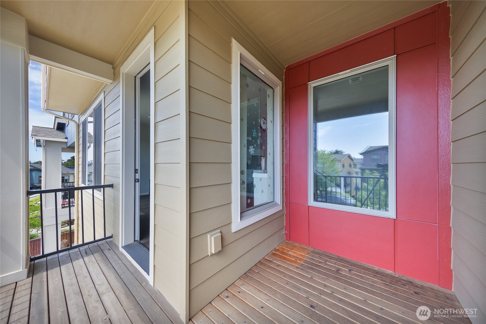 1066 Southwest 99th Place, Unit 55 Seattle, WA 98106 - Photo 3 of 21 a view of a balcony with wooden floor and outdoor space