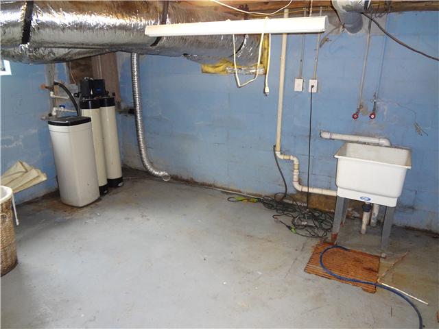 202 Johnson Branch Road Pulaski, TN 38478 - Photo 13 of 16 This utility room area is located in the basement and offers plenty of space for your washer and dryer. Also notice the "rain soft" water filtration system that is installed in the home.