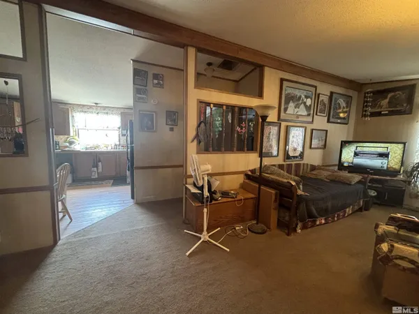 a living room with furniture window and wooden floor