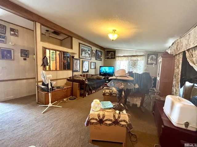 a spacious bedroom with a bed a couch and dresser