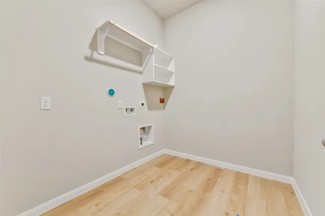 a bathroom with a sink a toilet a mirror a bathtub and shower