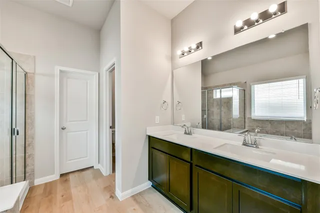 a bathroom with a bathtub and a shower