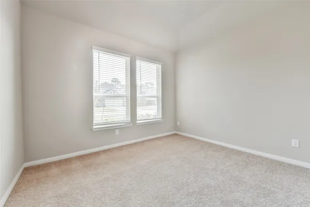 a view of an empty room and window