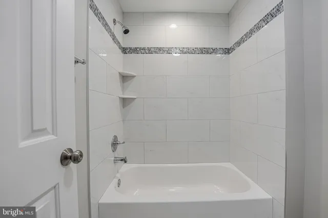 a close view of a bathtub in bathroom