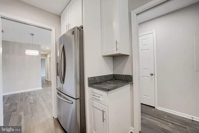 a kitchen with stainless steel appliances a refrigerator and a sink