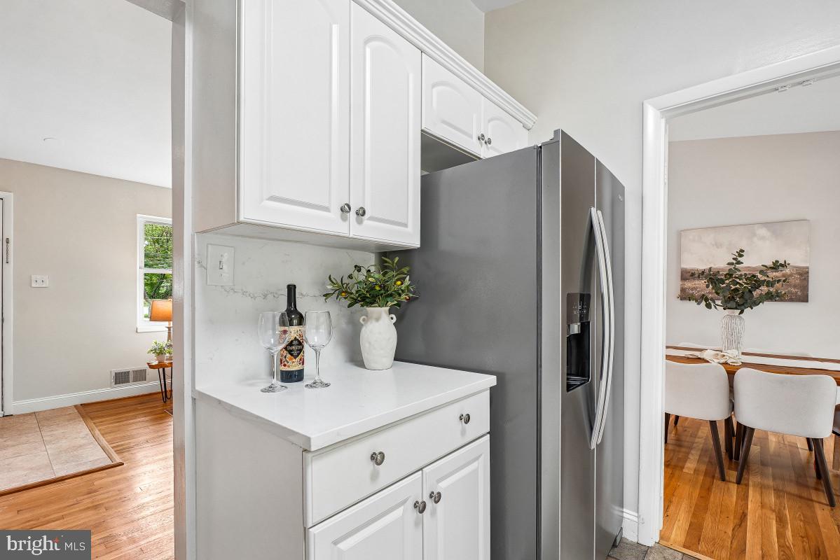 827 Caddington Avenue Silver Spring, MD 20901 - Photo 19 of 45 a kitchen with stainless steel appliances granite countertop a refrigerator and a stove
