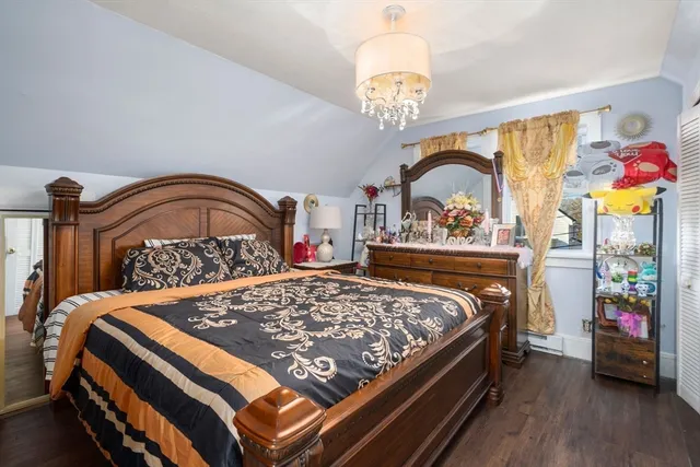 a bedroom with a bed and a dresser