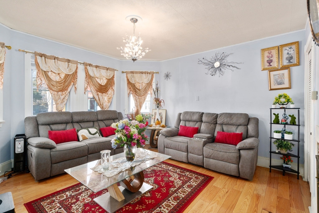 7 Sidney Avenue Lynn, MA 01902 - Photo 2 of 15 a living room with furniture and a wooden floor
