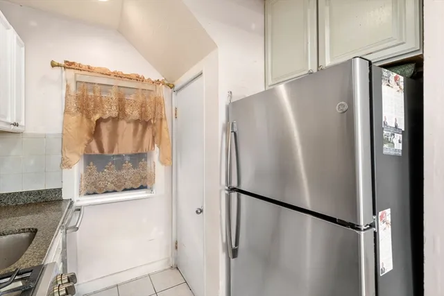 a white refrigerator freezer sitting inside of a kitchen