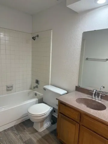 a bathroom with a sink a toilet and a bathtub