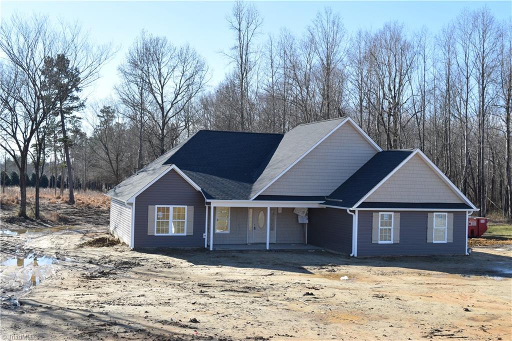 7909 Lester Road Stokesdale, NC 27357 - Photo 1 of 30 Exterior front and left side 1-6-21