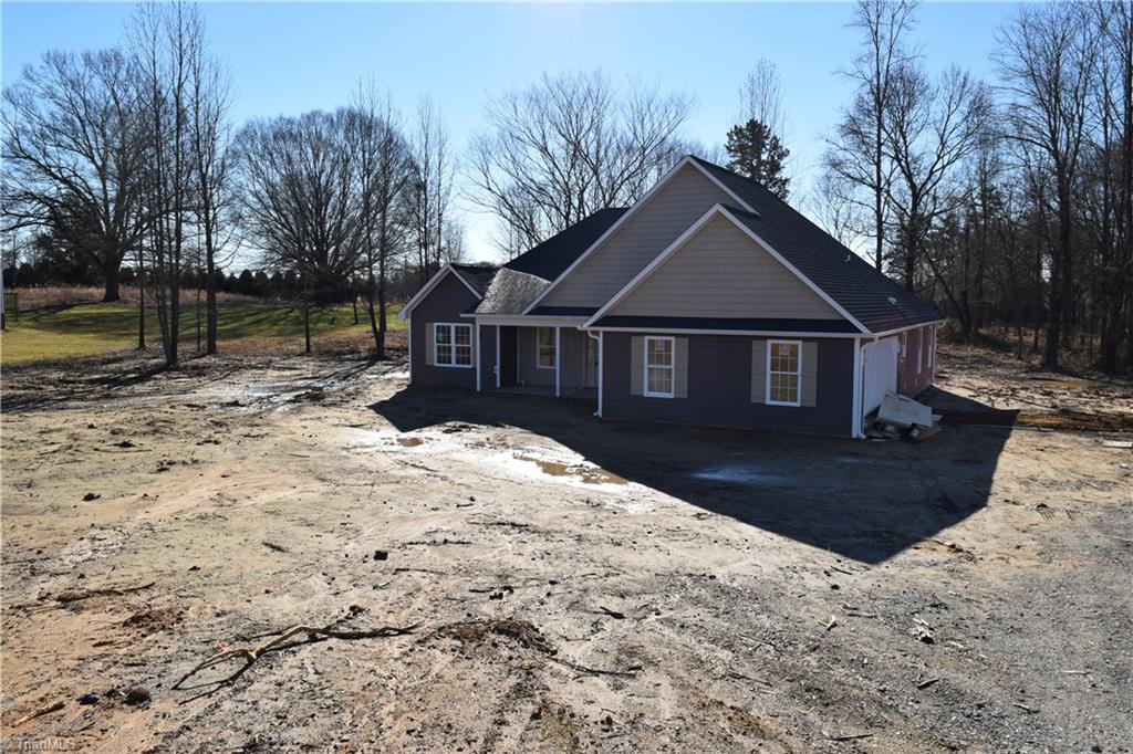 7909 Lester Road Stokesdale, NC 27357 - Photo 3 of 30 Exterior front and right side 1-6-21