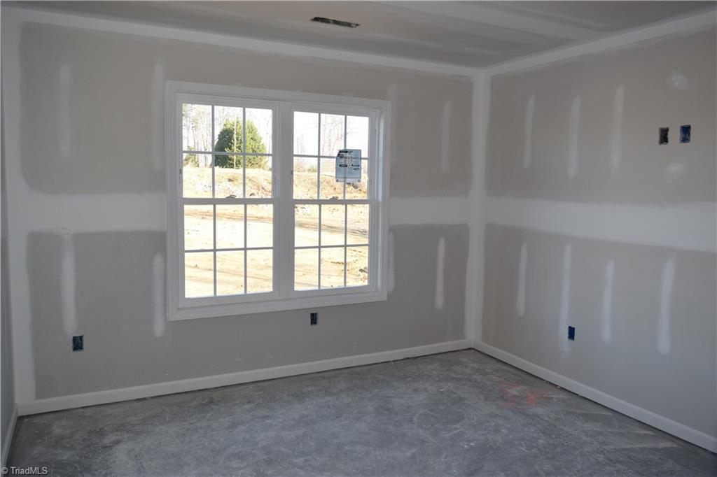 7909 Lester Road Stokesdale, NC 27357 - Photo 22 of 30 2nd bedroom on front 1-6-21
