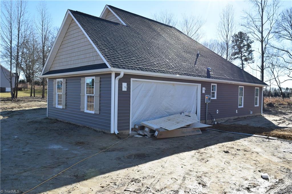 7909 Lester Road Stokesdale, NC 27357 - Photo 4 of 30 Right side 2 car garage 1-6-21