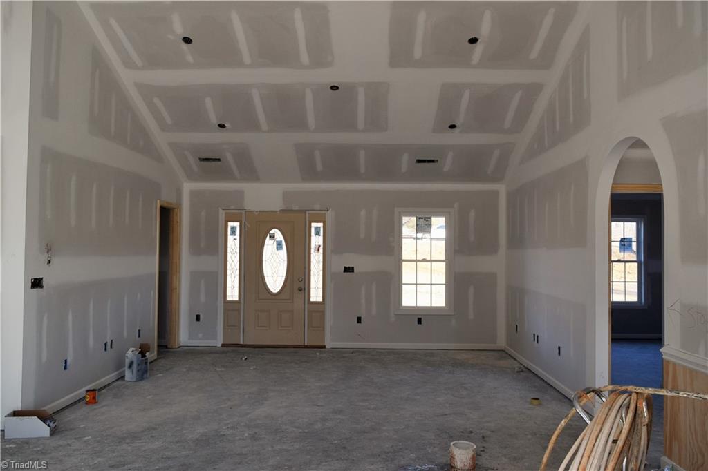 7909 Lester Road Stokesdale, NC 27357 - Photo 5 of 30 Living room front entry 1-6-21
