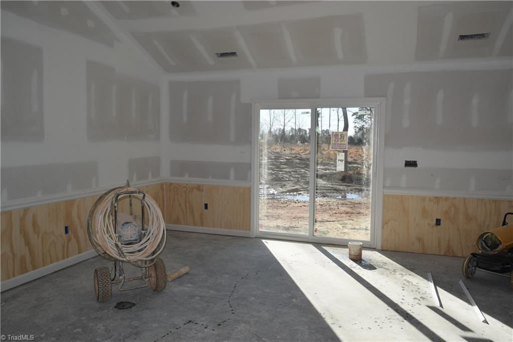 7909 Lester Road Stokesdale, NC 27357 - Photo 9 of 30 Dining area with door to back patio 1-6-21