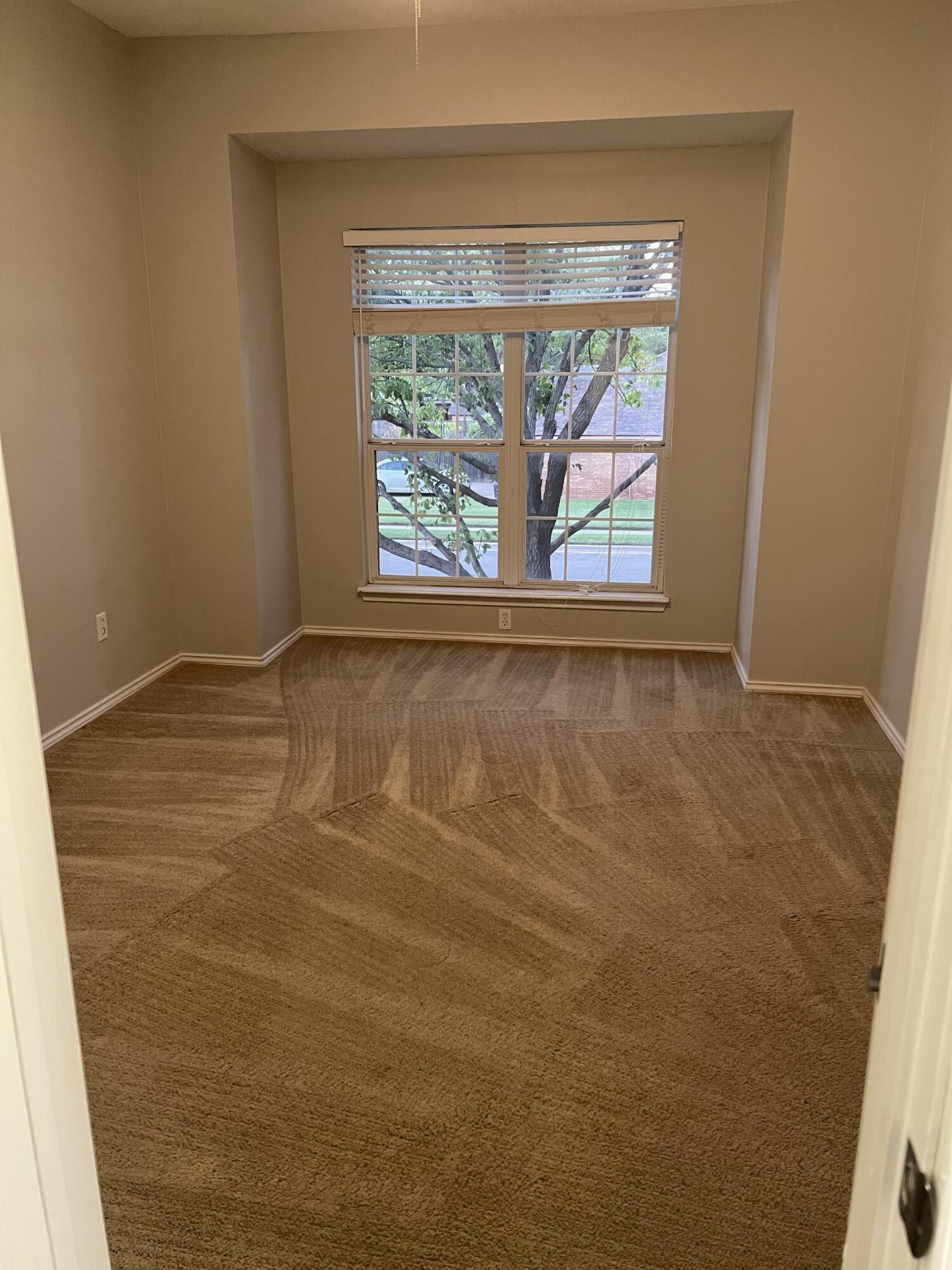 5102 80th Street Lubbock, TX 79424 - Photo 13 of 20 a view of empty room with window