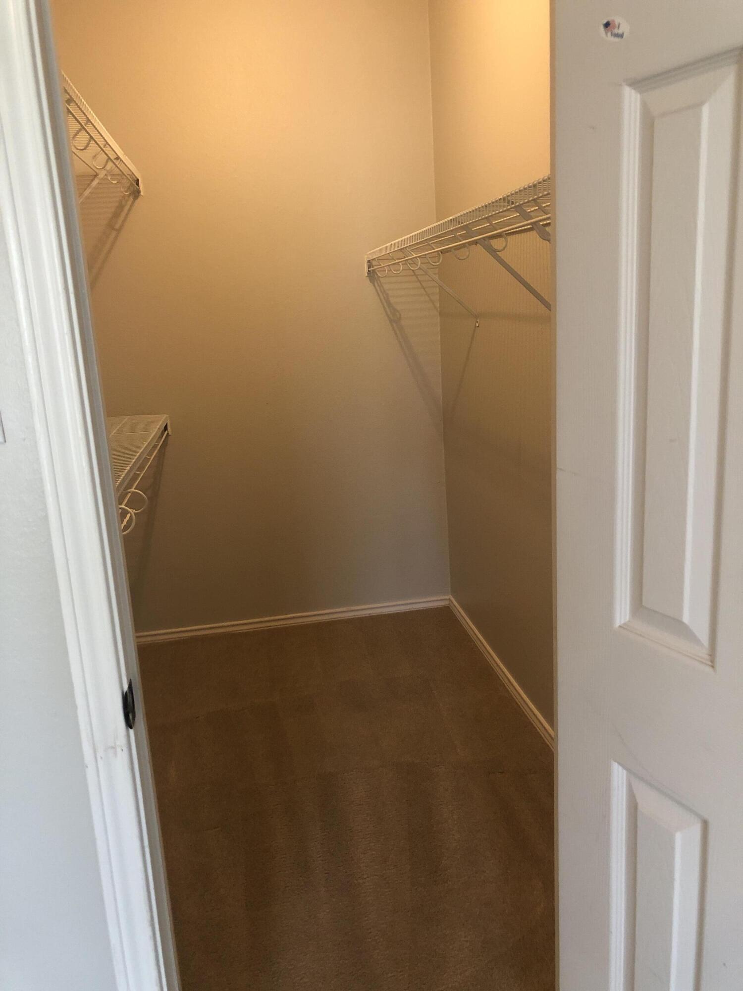 5102 80th Street Lubbock, TX 79424 - Photo 14 of 20 a view of small space with racks on the wall