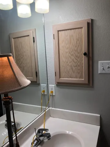 a bathroom with a bathtub and a sink